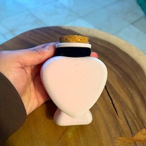 Light pink flocked heart shaped bottle